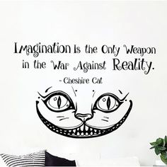 a black and white wall decal with an image of a cat's face