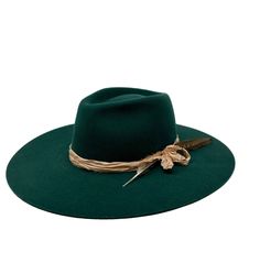 The montana fedora is made from a lite stockman felt and had a slightly rounder crown. There is no movement in the felt so please size accordingly Trimmed with vintage silks and a feather ,this emerald color is a deep and rich pop of color for your everyday. Made in the USA . 4" brim. ADD custom embroidery for your own look! exchange or site credit only small 21-22 inch circ medium 22-23 inch circ large 23-24 inch circ Emerald Color, Felt Hat, Custom Embroidery, Vintage Silk, Emerald Green, Fedora, Montana, Color Pop, Emerald