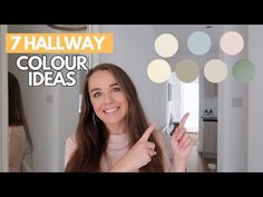 a woman pointing to the ceiling in front of a mirror that says 7 hallway color ideas