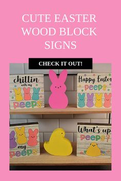 some wooden signs are on a shelf with bunny and chicky paintings in the background