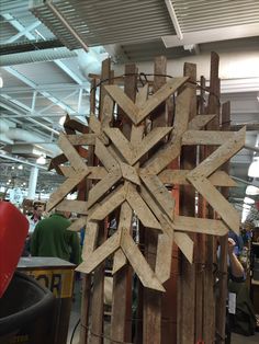 a large wooden snowflake sitting on top of a table