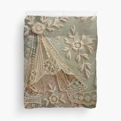 an old lace doily with flowers and leaves on green background duvet sheet set