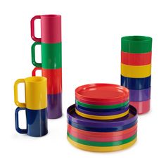 a stack of multicolored cups and mugs on a white background with one cup in the middle