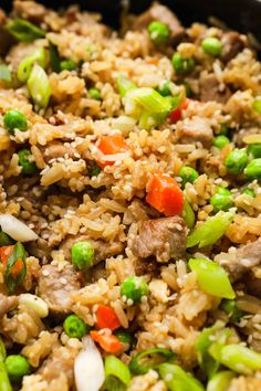 rice with meat and vegetables in a skillet ready to be eaten for lunch or dinner