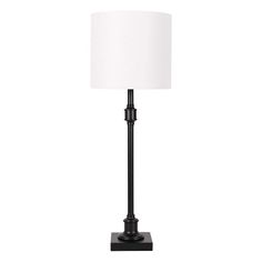 a black lamp with a white shade on it