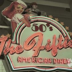 the sign for the fifties american diner is lit up