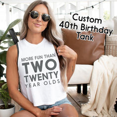 With its fun and cheeky design, this tank top is sure to be a hit at any 40th birthday party. It's a great choice for the birthday girl or as a gift for her closest friends. Plus, it's versatile enough to wear to a variety of other events, including bachelorette parties, girls' nights out, and more. So why settle for a boring tank when you can celebrate your 40th birthday in style? Get your "more fun than two twenty year olds" racerback tank today and make memories that will last a lifetime 40th Birthday Shirt, Birthday Tanks, 40th Birthday Shirts, 40th Birthday Party, Bachelorette Parties, Birthday Shirt, 40th Birthday, Birthday Girl, Racerback Tank Top