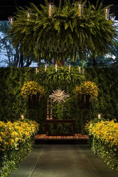 a bench surrounded by yellow flowers and greenery