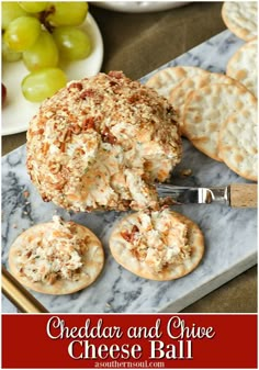 cheese ball with crackers and grapes in the background