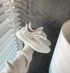 Disclaimer: Yeezys fit small - Go half a size up The adidas Yeezy Boost 350 V2 Bone is constructed with a triple white Primeknit upper, mesh side stripes, and canvas heel tabs. A semi-translucent sole with Boost technology completes the design at the bottom.Style: HQ6316Color scheme: Bone Yeezy 350 Bone, Yeezy Shoes Outfit, Yeezy Outfit Women, Yeezy Outfit, Adidas Yeezy 350 V2, 40 Women, Adidas Yeezy 350, Adidas Shoes Women