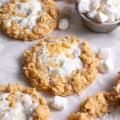 several cookies with marshmallows are on the table