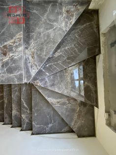 a room with marble walls and flooring that looks like it has been designed to look like