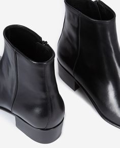 Smooth black leather boots | The Kooples - US Classic Black Boots With Zipper Closure, Sleek Black Boots With Zipper Closure, Leather Boots With Zipper Closure And Low Heel, Sleek Leather Boots With Zipper Closure, Black Heeled Boots With Zipper Closure For Business, Black Zipper Closure Heeled Boots For Business, Sleek Ankle Boots For Business, Black Calf Leather Boots With Zipper Closure, Sleek Leather Boots With Low Heel