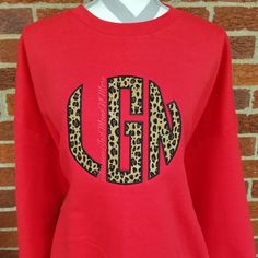 I am currently 3 weeks out on all orders, plus shipping time. Please take note when placing your order. You will receive a notification when your order ships. These sweatshirts are perfect for the cold weather!! The one pictured above is on a red sweatshirt with cheetah print fabric and black thread. This fabric is #78 in the drop down box. The sweatshirts are Gildan brand and are UNISEX! -50% cotton, 50% polyester -pill-resistant air jet yarn -double-needle stitching throughout -set-in sleeves Monogrammed Sweatshirt, Monogram Sweater, Monogram Sweatshirt, Leopard Print Fabric, Red Sweatshirt, Circle Monogram, Lexington Ky, Black Thread, Print Fabric