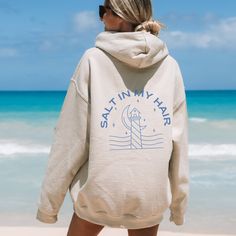 ✨ This hoodie is all about good beachy vibes. A fun little expression to add a smile to your face. ✨ The design is laid-back and casual, perfect for those lazy days or casual outings. This unisex heavy blend hooded sweatshirt is cozy and comforting all in one. Made with a thick blend of fabrics, it feels plush and soft, a perfect choice. The front has a spacious pocket that adds convenience. Also includes a drawstring on the hood itself. ☀️ SIZING☀️ ⚡️ Size up 2 sizes for oversized fit ⚡️ Unisex Hooded Cotton Top For Vacation, Cotton Hooded Top For Vacation, Summer Vacation Cotton Hoodie, Vsco Letter Print Sweatshirt For Beach, Trendy Sweatshirt For Beach In Spring, Cotton Hoodie For Summer Vacation, Casual Beach Hoodie Top, Trendy Spring Beach Sweatshirt, Oversized Hooded Top For Vacation