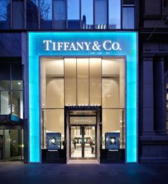 the entrance to tiffany & co store in new york city at night with blue lighting