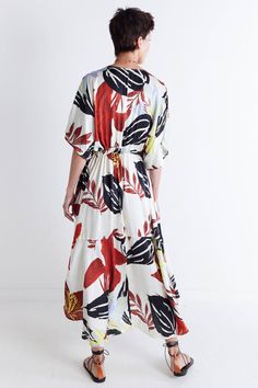 Say hello to sunny days with this one-of-a-kind dress, featuring a vibrant floral print and classic maxi silhouette. Style it heels or flats to dress up the look, or keep it more relaxed with sneakers or sandals. V-neckline Tie waist for adjustability Maxi length Side pockets *This item features an oversized fit. We recommend taking one size down in this style if a closer fit is preferred. Casual Multicolor Print Maxi Dress For Summer, Casual Patterned Printed Maxi Dress, Floral Print Patterned Maxi Dress For Garden Party, Chic Summer Patterned Maxi Dress, Patterned Printed Summer Maxi Dress, Patterned Printed Maxi Summer Dress, Vibrant Print Maxi Dress For Day Out, Patterned Printed Maxi Dress For Day Out, Casual Floral Print Patterned Maxi Dress