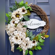 a welcome door wreath with sunflowers and greenery