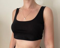 "Sporty Crop Tank Bra DETAILS  Classic cropped tank with scoop neck in Black. This 100% cotton jersey top is very comfortable, super soft and breathable. Model is 5'5\" and wearing Size XS/S FABRIC: 100% Cotton CARE: HAND WASH COLD. LAY FLAT TO DRY. Machine wash 30C. Tumble dry medium. Iron low heat. Do not bleach. Do not wring. Wash and dry dark colours separately. MADE IN INDIA" Dark Colours, Cashmere Jumper, Roll Neck, Jersey Top, Just The Way, Crop Tank, Cashmere Sweaters, Scoop Neck, Cashmere