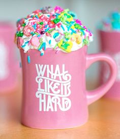 a pink coffee mug with sprinkles on it and the words what like is hard