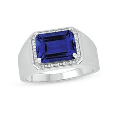 Simple yet striking, this men's diamond ring is bursting with color. Crafted in sterling silver, this style showcases a sideways 11.0 x 9.0mm emerald-cut bright blue lab-created sapphire surrounded by a frame of diamonds. Radiant with 1/10 ct. t.w. of diamonds and a brilliant buffed luster, this tapered-shank ring draws all the right kinds of attention. Formal Sapphire Ring With Center Stone, Classic Sterling Silver Signet Ring With Accent Stones, Modern Diamond Signet Ring With Gemstone, Blue Diamond Signet Ring With Polished Finish, Mens Sapphire Ring, Frame Ring, Diamond Frame, Men Diamond Ring, Sterling Silver Mens