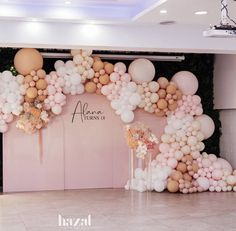 balloons and streamers are on the wall in front of an entrance to a party