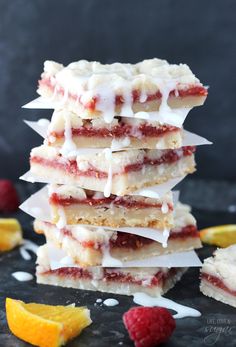 a stack of raspberry lemonade shortbreads with white frosting on top