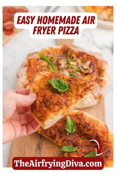 a hand holding a slice of pizza with basil on it and the text easy homemade air fryer pizza