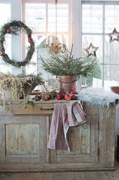 an old dresser is decorated with christmas decorations