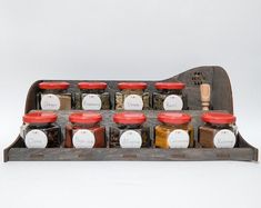 an old wooden spice rack filled with different types of spices