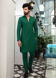 Include: Kurta Fabric: Kurta: Cotton Color: Deep green Work Technique: Embroidery Description: A deep green cotton kurta enhanced with geometric embroidered details and loop buttons bring class and elegance to Columbia. Pair it with matching trousers to make this a statement outfit. This is a 1 piece stitched outfit. Disclaimer: The color of the outfit may vary due to lightening effect of photography Kurta Designs Men's, Pakistani Kurta, Wedding Kurta For Men, Kurta Pajama Men, Mehendi Outfit, Kurta Cotton, Kurta Patterns, Kurta Men