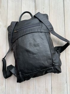 "Very light Leather Backpack, Recycled Leather Rucksack, Black Backpack LeaF minimalist light women's leather backpack is made from high quality upcycled leather. Most of our works are in minimalist design and suits for everyday or special events. LeaF leather backpacks are very light and not overloads your back. If you need to carry only a few things, this convertible backpack purse could be used as clutch - just roll it or fold it. Minimalist design leather backpack fits 13\" laptop. FEATURES Functional Soft Leather Backpack For Daily Use, Functional Soft Leather Everyday Backpack, Functional Soft Leather Backpack, Everyday Functional Soft Leather Backpack, Everyday Leather Backpack, Functional Backpack With Leather Backing For Everyday Use, Black Leather Urban Backpack, Black Urban Leather Backpack, Urban Style Black Leather Backpack