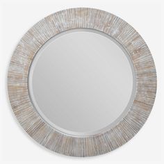 a round mirror that is made out of wood