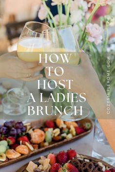 two people toasting wine glasses over a platter of fruit and nuts with the words how to host a ladies'brunch