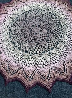 a crocheted doily is laying on the floor