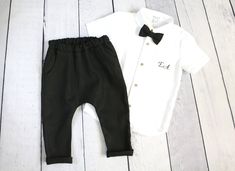 Baby & toddler short sleeve linen mandarin collar shirt with personalized initials. The shirt is accentuated by the wooden or white buttons. Great for wedding party, baptism, blessings, birthday party or any other special occasion... * COLORS : - White linen shirt * DELIVERY: This item is made to order and processing time is 2-4 business days from the order. In each case, I will tell you the exact date of readiness for delivery. Your order will be beautifully packaged. All items are sent by Baby Baptism Outfit, Shorts With Suspenders, Baby Boy Baptism Outfit, Baby Suspenders, Boy Baptism Outfit, Linen Harem Pants, Boy Monogram, Baby Boy Baptism, Baptism Outfit