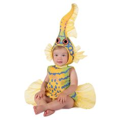 a baby dressed in a yellow fish costume