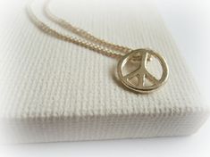 Little peace symbol sterling silver necklace - Tiny Peace Charm Necklace - Sterling Silver Peace nec Peace Jewelry, Cowrie Shell Necklace, Owl Pendant Necklace, Symbol Necklace, Owl Pendant, Shell Necklace, Cowrie Shell, Apple Green, Rolo Chain