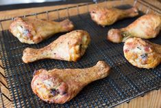 some chicken legs are on a cooling rack