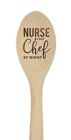 a wooden spoon that says teacher by day chef by night