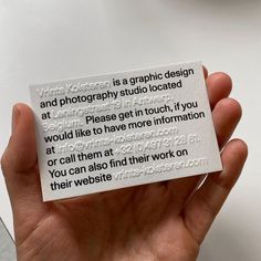 a person holding up a piece of paper that says, yes photographer is a graphic design and photography studio located at