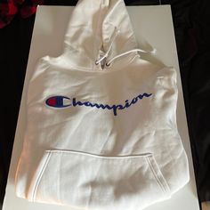 Mens Champion Hoodie, Color-White, Size-Medium, Never Worn, Still Has Tags On It, Soft Sports White Hoodie With Letter Print, White Fleece Hoodie With Adjustable Hood, White Crew Neck Sweatshirt With Drawstring Hood, White Crew Neck Hoodie With Logo Print, White Sports Hoodie With Adjustable Hood, White Hoodie With Logo Print For Winter, White Fleece Hoodie With Logo Print, White Logo Print Hoodie For Winter, White Crew Neck Sweatshirt With Adjustable Hood