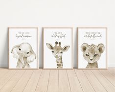 three framed pictures with animals on them in front of a white wall and wooden floor