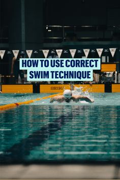 a swimming pool with swimmers in it and a sign that says how to use correct swim technique