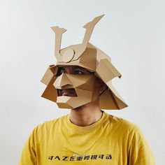 This is a pdf template to make Samurai helmet with mask from a used cardboard box (maximum 4mm thickness for best result). This template although it can be applied to paper, it is not the same as papercraft. This template is optimized for corrugated-cardboard box which has thickness (unlike papercraft which the thickness is neglected). We designed this template so that each part fits in A4 paper. This means you don't need a wide cardboard. You can use it on small cardboard scraps or small cardboard box.  Check our Instagram:  ->> @krafstudio <<-  for more details. What's inside the zip file? 1. the pattern/template in .pdf format 2. user manual and guide with a qr-code and clickable link to the video tutorial 3. tutorial on rescaling the pattern. 4. tips on how to make neat result 5. list Cardboard Mask Template Free Printable, Wearable Cardboard Art, Mask Cardboard, Cardboard Samurai Armor, Samurai Helmet Cardboard, Samurai Cardboard Armor, A4 Sticker, Paper Binder, Cardboard Mask