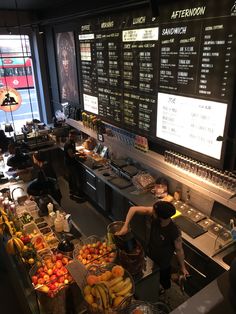 a man standing in front of a counter filled with lots of food