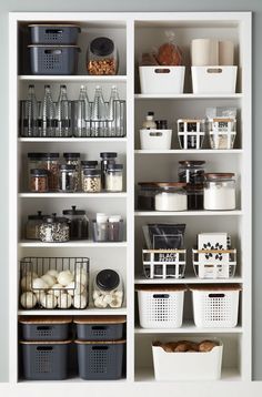 an organized pantry with baskets and containers