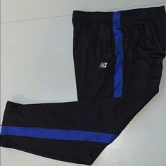 Brand New With Tags. Size Xxl. Black With Blue Stripe Black New Balance Sports Bottoms, New Balance Black Bottoms For Sports, New Balance Black Sports Bottoms, New Balance Sporty Black Bottoms, New Balance Black, Track Pants, Blue Stripes, New Balance, Black Blue