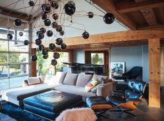 a living room filled with furniture and lots of windows