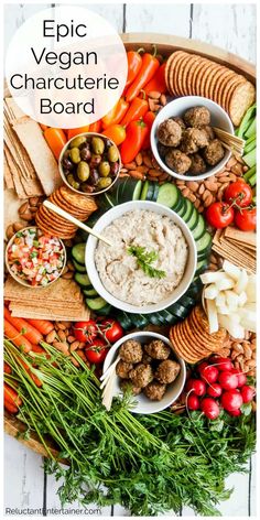 a platter filled with meatballs, vegetables and dips for a vegan charcuterie board